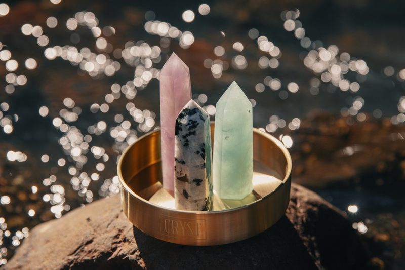 Pisces zodiac star sign crystal set including Rainbow Moonstone, Green Fluorite and Amethyst crystals on a CRYST Collective brass base. Buy crystals online at Cryst Collective and feel the benefits.
