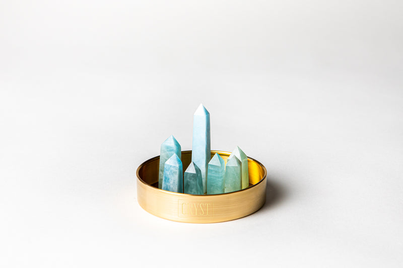 Aquamarine mini cluster crystal points decor set. Crystal benefits are calming, communication and courage. Aquamarine Mini Cluster crystal set featuring 7 hand-cut Aquamarine crystals. Buy crystals online at Cryst Collective.