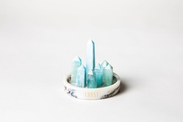 Aquamarine mini cluster crystal points decor set. Crystal benefits are calming, communication and courage. Aquamarine Mini Cluster crystal set featuring 7 hand-cut Aquamarine crystals. Buy crystals online at Cryst Collective.