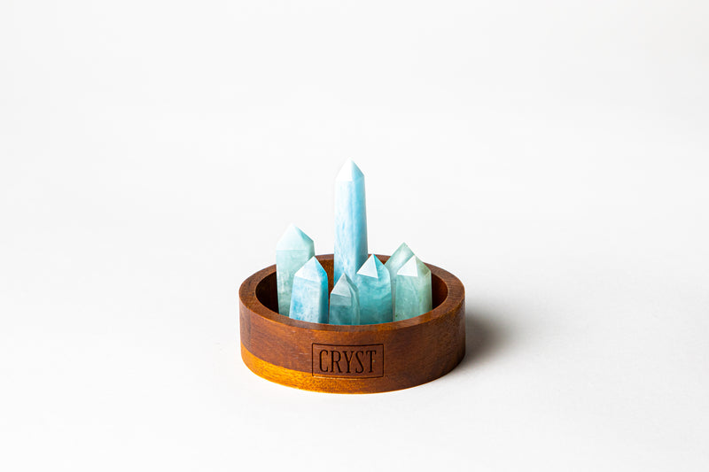 Aquamarine mini cluster crystal points decor set. Crystal benefits: calming, communication and courage. Aquamarine Mini Cluster crystal set featuring 7 hand-cut Aquamarine crystals. Buy crystals online at Cryst Collective.