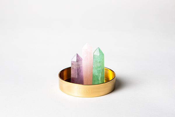 Aquarius zodiac star sign crystal set including amethyst, rose quartz and green fluorite crystals on a CRYST Collective brass base. Buy crystals online at Cryst Collective.