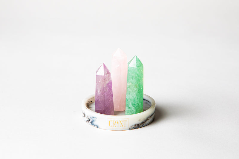 Aquarius zodiac star sign crystal set including amethyst, rose quartz and green fluorite crystals on a CRYST Collective marble base. Buy crystals online at Cryst Collective.