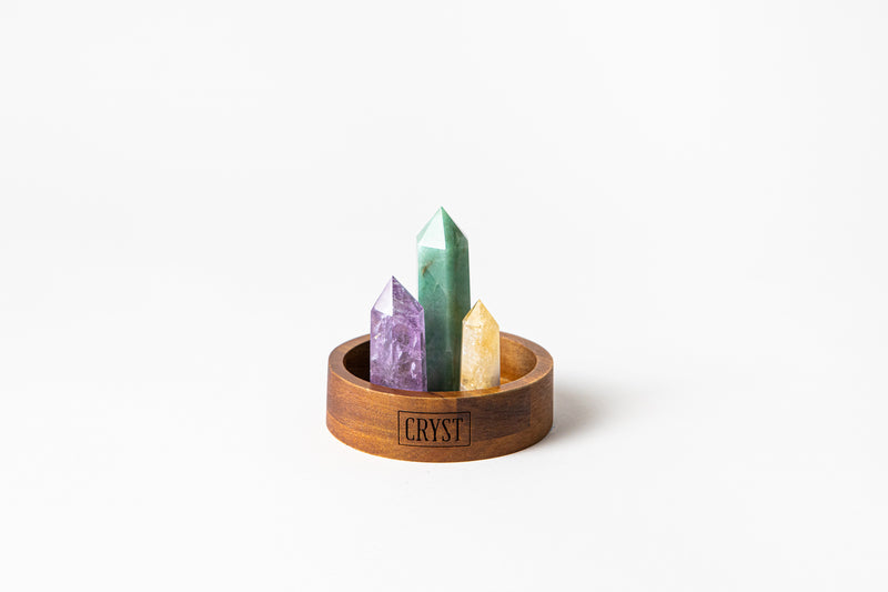 Aries zodiac star sign crystal set including amethyst, citrine and green aventurine crystals on a CRYST Collective wood base. Buy crystals online at Cryst Collective.