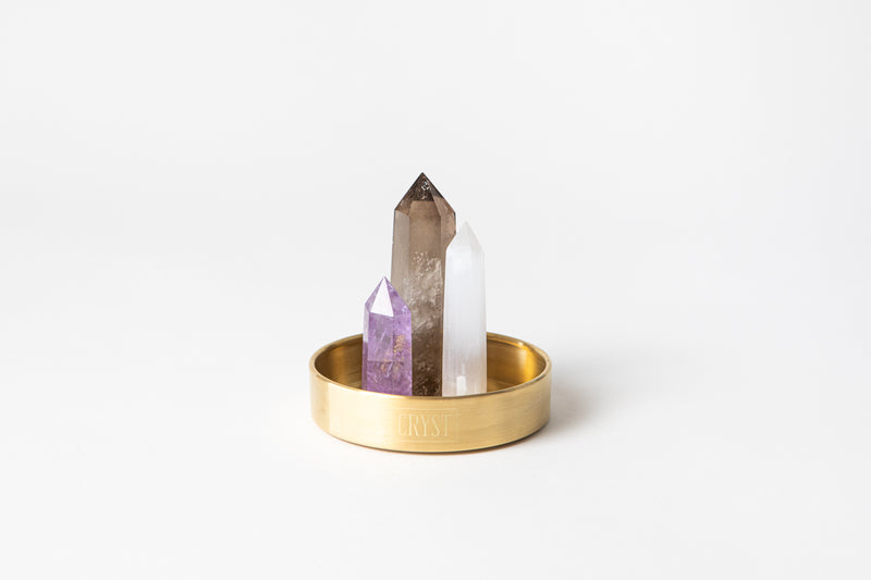 Calm Mind Trio crystal set including authentic amethyst (purple), selenite (white), smoky quartz (grey) crystal points on a CRYST Collective brass base