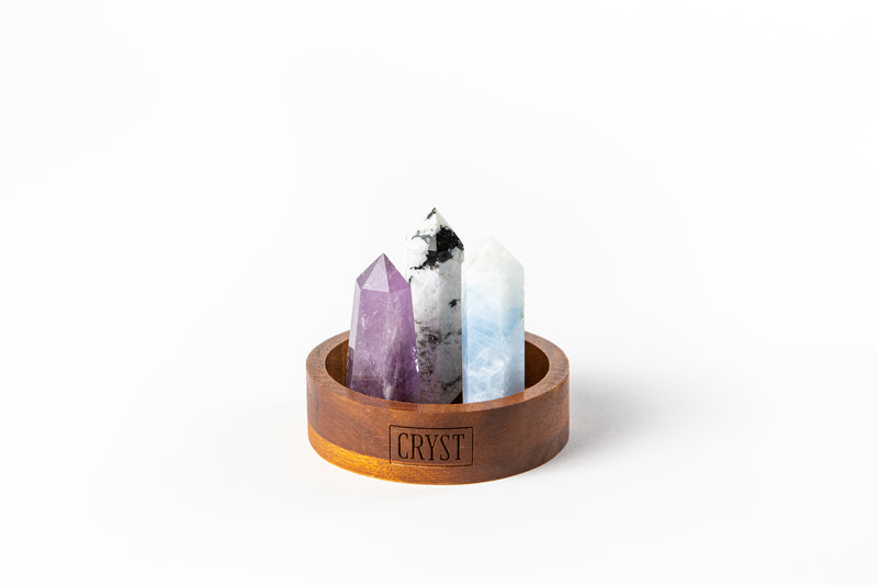 Cancer zodiac sign crystal set including blue calcite, rainbow moonstone and amethyst authentic crystals on CRYST Collective wood base. Buy crystals online at Cryst Collective.