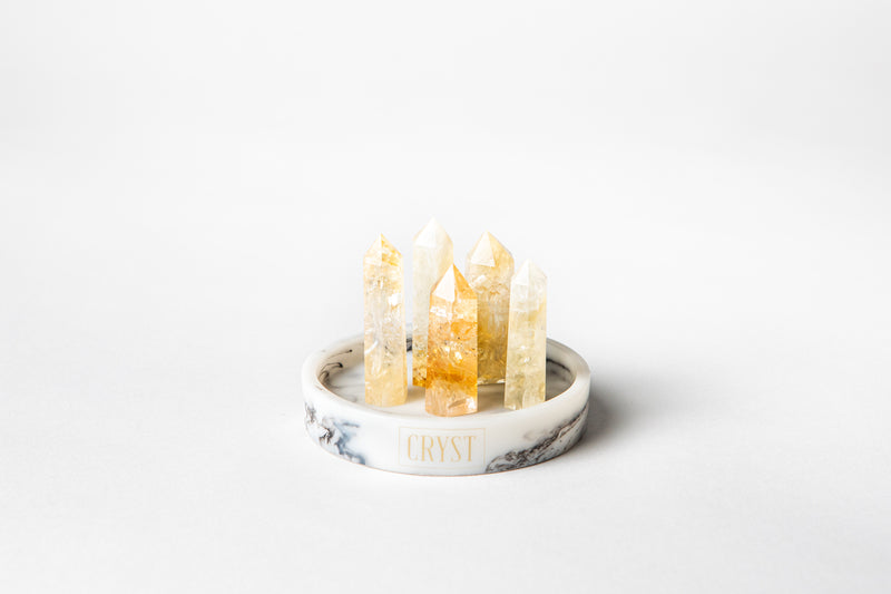 The Citrine Mini Cluster crystal set comes as a set of 5 authentic citrine crystal points on a CRYST Collective white marble base. Citrine is an abundance stone, encouraging self-confidence, concentration and creativity. Buy crystals online and feel the benefits of having crystals in your space.