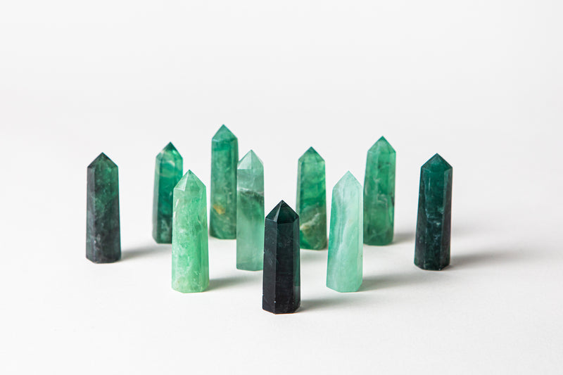 Green fluorite authentic crystal points.  Buy different types of crystals online at Cryst Collective.