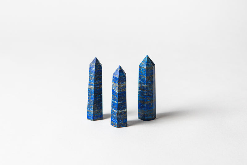 Lapis Lazuli authentic crystal points, a stone that opens your intuition and connection to spirit. Buy crystals online at Cryst Collective and feel the benefits of having crystals in your space,