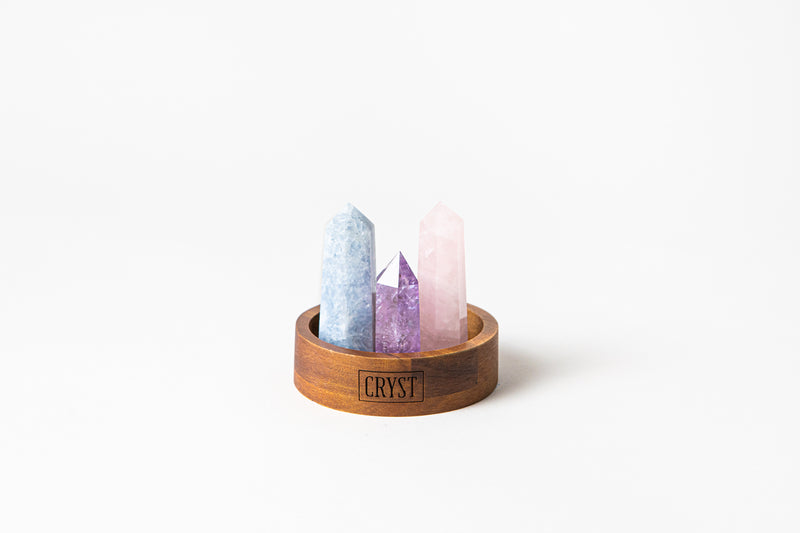 The Mothers Trio crystal set includes rose quartz, blue calcite and amethyst crystals. These crystals work in synergy to encourage self-love, self-compassion and facilitate open communication; comes on a CRYST Collective wood base. CRYST Collective modern interior decor pieces Australia.