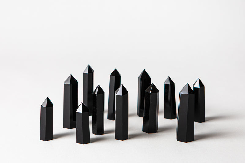 Black Onyx authentic crystal points helps alleviate fears and worries, stone of strength. Buy crystals online at Cryst Collective.