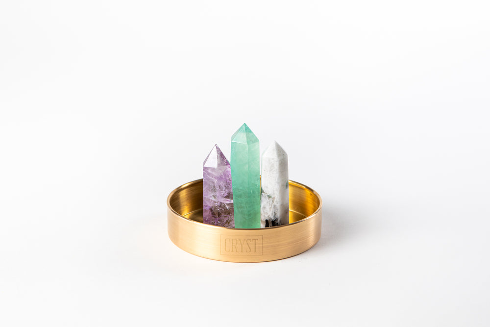 Pisces zodiac star sign crystal set including Rainbow Moonstone, Green Fluorite and Amethyst crystals on a CRYST Collective brass base. Buy crystals online at Cryst Collective and feel the benefits.