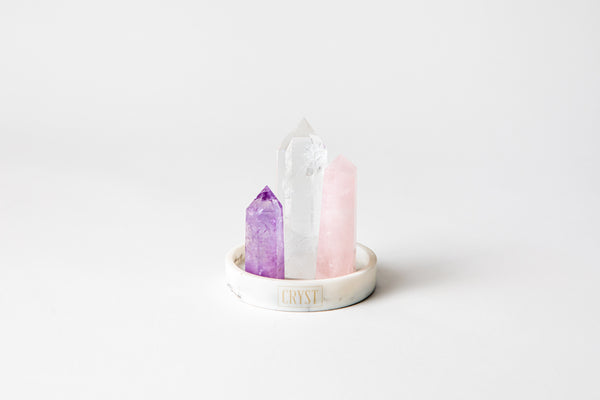 Relaxation Trio crystal set includes Rose Quartz, Amethyst and Clear Quartz to calm the mind and open your heart. Cryst Collective white base.