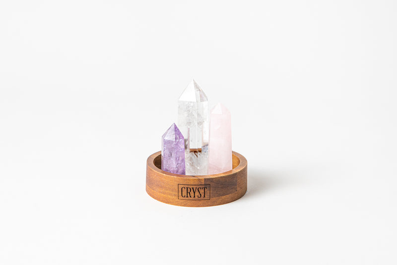 Relaxation Trio crystal set includes Rose Quartz, Amethyst and Clear Quartz to calm the mind and open your heart. Cryst Collective wood base.