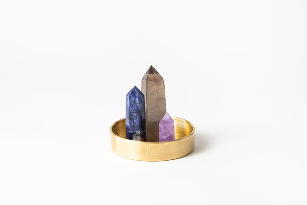 Sagittarius zodiac star sign crystal set including amethyst, smoky quartz and sodalite crystals on a CRYST Collective brass base. Buy crystals online at Cryst Collective.