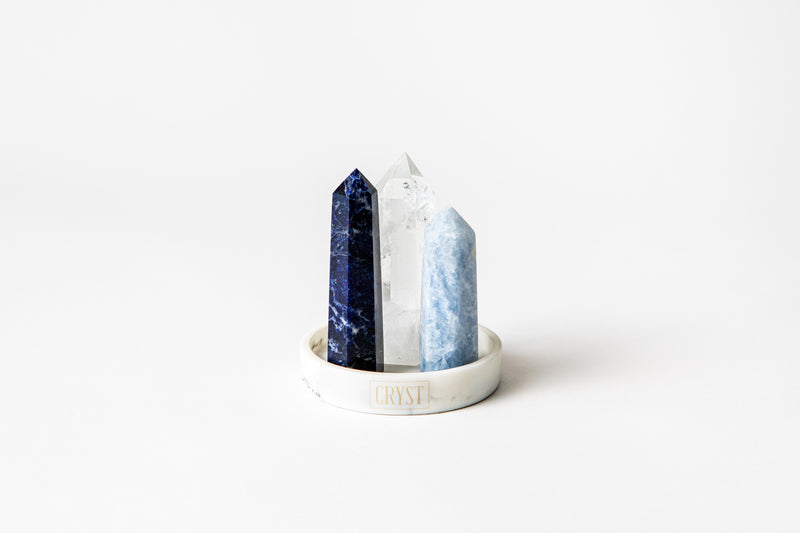 Your Authentic Truth trio crystal set includes Sodalite, Clear Quartz and Blue Calcite crystals. These crystals work in synergy to promote authenticity, individuality and self-expression, comes on a CRYST Collective white marble base. CRYST Collective modern interior decor pieces Australia.
